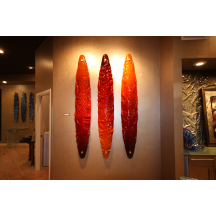 Three Amigos

	The Three Amigos Boat Series by Greg Schadt.  Three Amigos salsa inspired boat series 14" X 84" kiln cast wall sculpture with 4" standoffs for mounting.  List Price $6800.00 (also available as individual pieces)